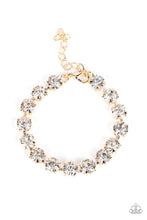 Load image into Gallery viewer, Featuring pronged gold fittings, an oversized row of glassy white rhinestones connect around the wrist for a glamorous pop of glitz. Features an adjustable clasp closure.
