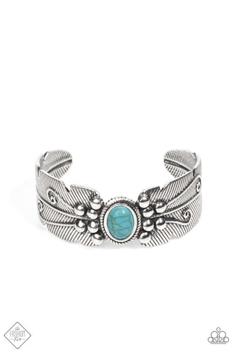 A single oval turquoise stone, framed in rope-like texture, dots the center of an ornate antiqued silver cuff bracelet. Adorned with studded texture and vine-like motifs, the feathered cuff wraps around the wrist in a tranquil earthy finish.  Sold as one individual bracelet.  New Kit Fashion Fix