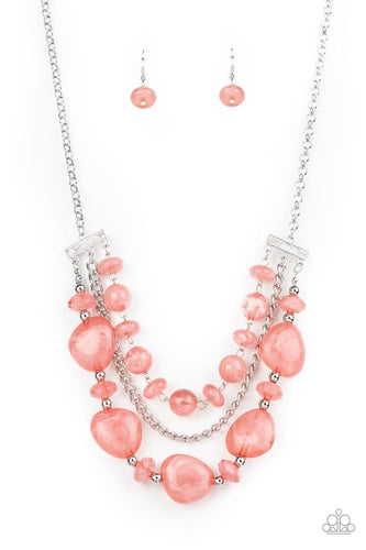 A single silver chain separates two mismatched rows of oversized and cloudy glass-like pink beads. The colorful rows are held in place with textured silver fittings, creating an ethereal pop of color below the collar. Features an adjustable clasp closure.