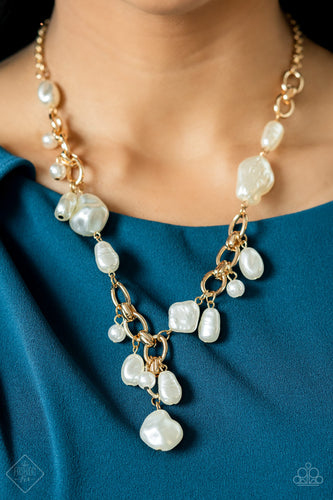 A modern collection of asymmetrical pearly white beads adorn sections of a chunky gold chain below the collar. Matching pearly beads sporadically trickle from the chain, resulting in a timelessly tasseled display. Features an adjustable clasp closure.  Sold as one individual necklace. Includes one pair of matching earrings.  New Kit Fashion Fix