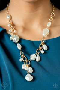 A modern collection of asymmetrical pearly white beads adorn sections of a chunky gold chain below the collar. Matching pearly beads sporadically trickle from the chain, resulting in a timelessly tasseled display. Features an adjustable clasp closure.  Sold as one individual necklace. Includes one pair of matching earrings.  New Kit Fashion Fix