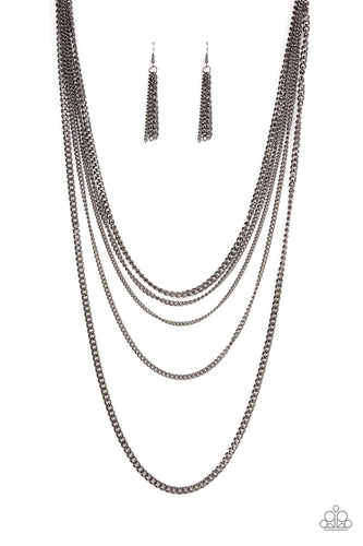 An intense display of mismatched gunmetal chains boldly layer across the chest, resulting in an edgy industrial vibe. Features an adjustable clasp closure. Sold as one individual necklace. Includes one pair of matching earrings.