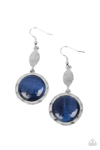 Encased in a hammered silver frame, an oversized blue cat's eye stone swings from the bottom of a hammered silver marquise shaped frame for a magically whimsical look. Earring attaches to a standard fishhook fitting.