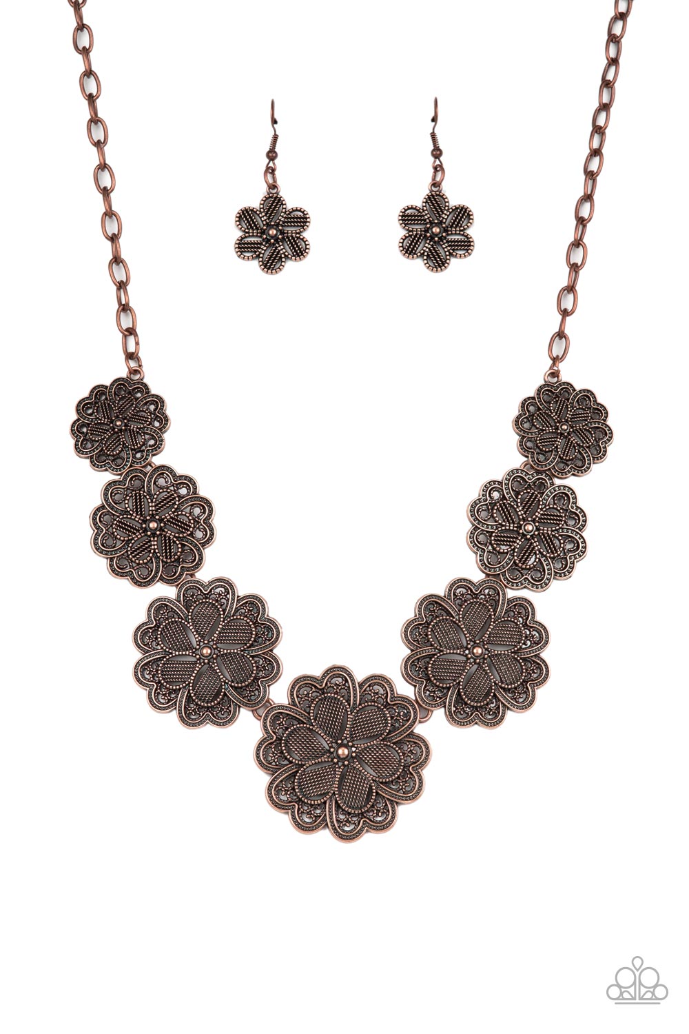 Featuring metallic wicker-like patterns, stacks of teardrop and heart shaped filigree-filled copper petals delicately link into a decorative row of flowers. The floral frames gradually increase in size as they move towards the center, creating a vintage inspired display below the collar. Features an adjustable clasp closure. 