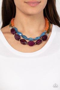 Faceted strands of opaque orange and Olive Branch crystal-like beads give way to a colorful assortment of oversized blue and plum crystal-like accents. Shiny silver beads adorn the hearty layers, adding a dash of metallic glitz to the tropical inspired display. Features an adjustable clasp closure. 