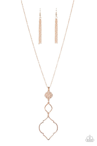 Featuring mandala-like patterns, a floral lattice frame gives way to mismatched scalloped rose gold frames, creating a magnificently stacked pendant at the bottom of an extended rose gold chain. Features an adjustable clasp closure.