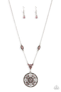 Glittery pink rhinestones are sprinkled across a silver floral frame, creating a timeless pendant at the bottom of a dainty silver chain that has been enhanced with matching pink rhinestone embellished frames. Features an adjustable clasp closure. 