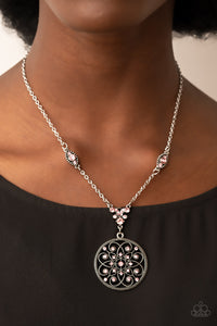 Glittery pink rhinestones are sprinkled across a silver floral frame, creating a timeless pendant at the bottom of a dainty silver chain that has been enhanced with matching pink rhinestone embellished frames. Features an adjustable clasp closure. 