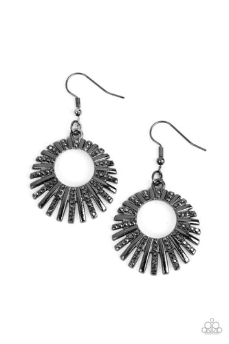 Rows of glistening gunmetal and smoky hematite dotted gunmetal bars asymmetrically flare out from an airy center, creating a gritty halo. Earring attaches to a standard fishhook fitting.