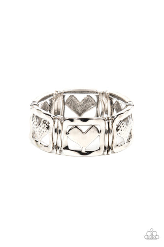 Encased in hammered silver frames, hammered silver hearts and silver hearts featuring a hammered dotted motif join pairs of wavy silver frames along stretchy bands around the wrist for a romantic flair.