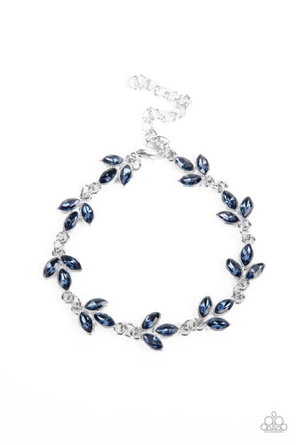 Twinkling trios of marquise cut blue rhinestones gather into leafy frames as they delicately link around the wrist, resulting in a radiant centerpiece. Features an adjustable clasp closure.