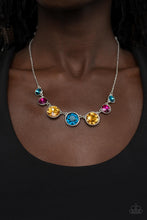 Load image into Gallery viewer, Encased in shiny silver frames, a glitzy collection of blue, yellow, and pink rhinestones gradually increase in size as they link below the collar for a flawless finish. Features an adjustable clasp closure.
