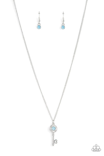 Bordered in glassy white rhinestones, an opal blue rhinestone adorns a shiny silver key pendant at the bottom of a dainty silver chain for a whimsical fashion. Features an adjustable clasp closure. 
