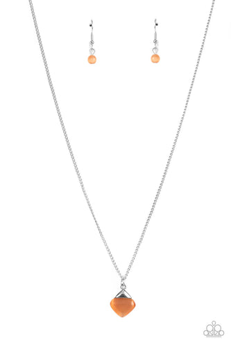 A silver triangle frame tops a triangular cut orange cat's eye stone pendant at the bottom of a dainty silver chain, resulting in a graceful gemstone pendant below the collar. Features an adjustable clasp closure. 