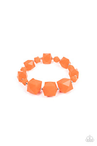 Varying in size, a faceted collection of solid and translucent orange cube beads alternate with dainty silver beads to decorate a stretchy band that wraps around the wrist for a glamorous pop of geometric color.