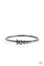 Load image into Gallery viewer, Glistening gunmetal stars graduate in size across the center of a textured gunmetal bangle, creating a stackable stellar centerpiece around the wrist. 
