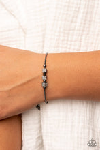 Load image into Gallery viewer, Dainty gunmetal beads and white rhinestone encrusted gunmetal cubes slide along a rounded gunmetal snake chain around the wrist, resulting in a radiant centerpiece. Features an adjustable sliding bead closure. 
