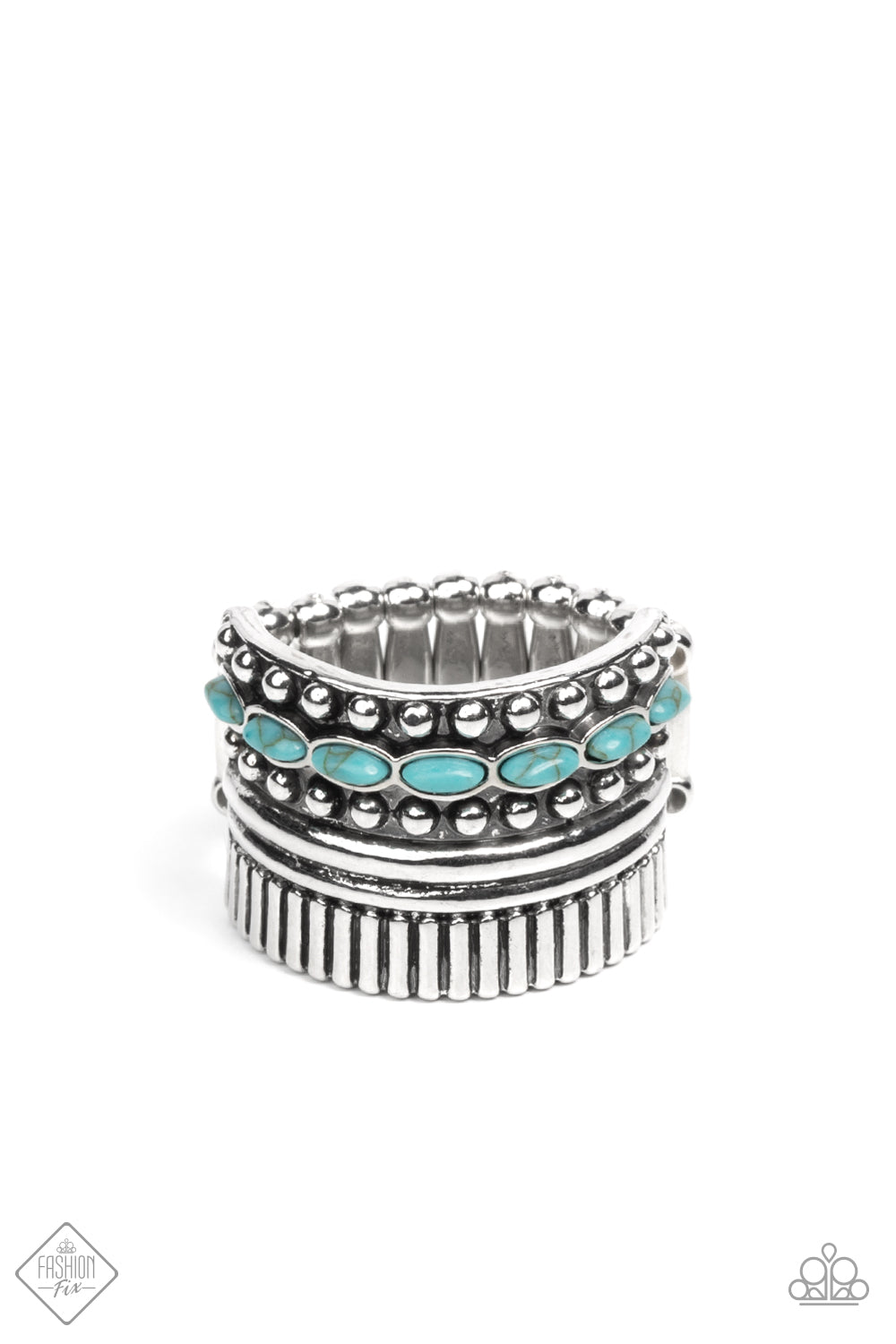 A wide silver band is overlaid with layers of linear texture, smooth silver bars, and antiqued studs. A row of dainty oval shaped turquoise stones flows across the band, adding a splash of color atop the finger. Features a stretchy band for a flexible fit.  Sold as one individual ring.  Fashion Fix