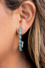 Load image into Gallery viewer, Small turquoise stones pressed into simple silver oval frames stack end to end as they fall from the ear and delicately curve into a J-shaped hoop for a refreshing finish. Earring attaches to a standard post fitting. Hoop measures approximately 1&quot; in diameter.  Sold as one pair of hoop earrings.  Fashion Fix
