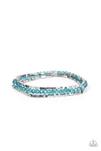 Load image into Gallery viewer, Two rows of dainty silver cube beads and one row of iridescent blue crystal-like beads are threaded along stretchy bands around the wrist, creating stellar layers. 
