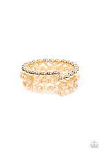 Load image into Gallery viewer, Sections of glistening gold beads and an alternating pattern of golden and iridescent flecked gems gradually increase in size along a coiled wire, creating a jaw-dropping infinity wrap bracelet around the wrist.
