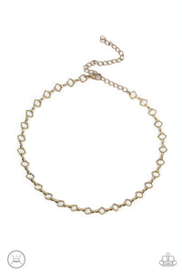 Featuring an antiqued brass finish, a dainty collection of square frames and pinched fittings delicately link into a minimalist inspired chain around the neck. Features an adjustable clasp closure.