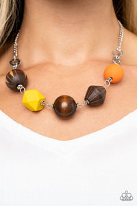 Infused with yellow and orange wooden beads, a mismatched assortment of studded silver hoops, textured silver rings, and oversized brown wooden beads delicately connect across the chest for a stylishly handcrafted fashion. Features an adjustable clasp closure.