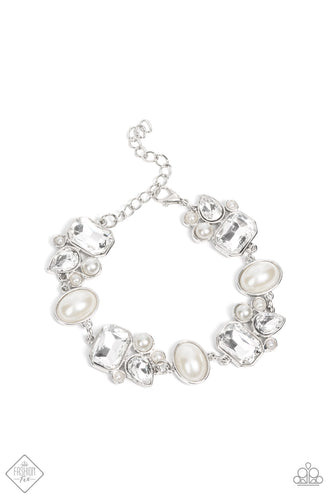 Showstopping teardrop and emerald cut rhinestones, accented with bubbly pearl beads, coalesce into stunning asymmetrical frames. A trio of elegant white oval pearl beads delicately alternate with the asymmetrical renditions for a glamorous finish around the wrist. Features an adjustable clasp closure.  Sold as one individual bracelet.  Fashion Fix