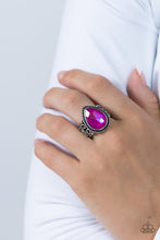 Load image into Gallery viewer, Featuring an iridescent UV finish, an oversized pink teardrop gem is pressed in the center of a textured silver frame atop a thick silver band whirling with silver filigree. Features a stretchy band for a flexible fit.
