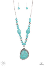 Load image into Gallery viewer, A lengthened silver chain flows into a succession of polished turquoise beads and silver accents. The flowy display gives way to an opulent turquoise stone that is pressed into an ornate silver frame. Adorned with fanciful antiqued silver flower, vine, and feather-like motifs, the elegantly rustic pendant makes a striking impact. Features an adjustable clasp closure.  Sold as one individual necklace. Includes one pair of matching earrings.  New Kit Fashion Fix
