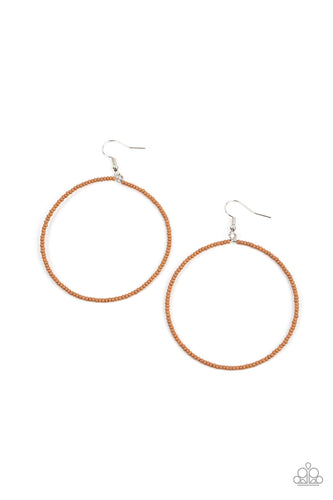 Dainty brown seed beads are delicately threaded along a silver wire hoop, creating a neutral pop of color. Earring attaches to a standard fishhook fitting.