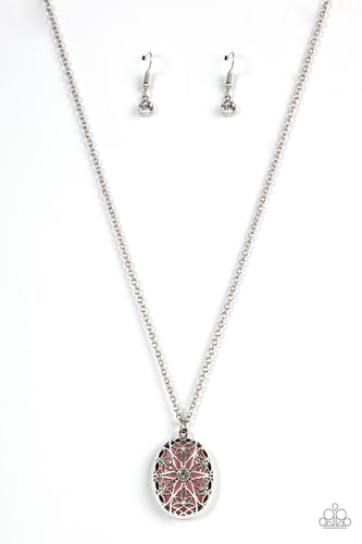Dotted with a glitzy white rhinestone center, studded and smooth floral filigree detail blooms across the front of an oversized pink cat's eye stone, resulting in a whimsical pendant at the bottom of a silver chain. Features an adjustable clasp closure.