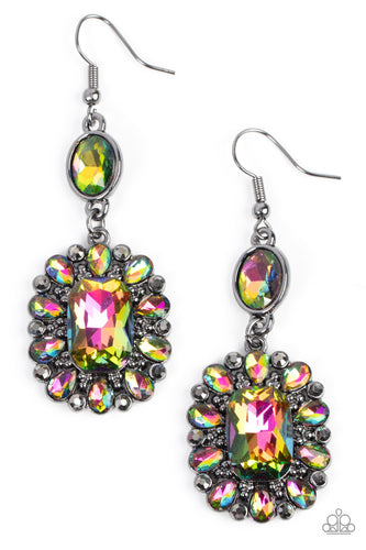 Dainty hematite rhinestones and teardrop oil spill gems fan out from an oversized oil spill emerald cut gem at the bottom of a solitaire oval oil spill gem, resulting in a glamorously glitzy lure. Earring attaches to a standard fishhook fitting.