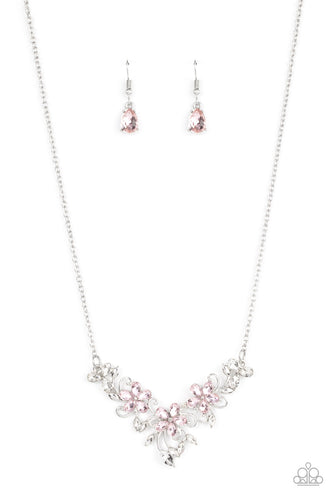 A twinkly trio of pink rhinestone petaled flowers bloom atop a leafy silver backdrop adorned in marquise cut white rhinestones, resulting in a timeless floral centerpiece below the collar. Features an adjustable clasp closure.