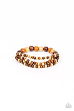 Load image into Gallery viewer, Varying in natural wooden finishes, stretchy strands of dainty wooden beads attach to a single row of oversized wooden beads around the wrist for an earthy spin on the homespun trend.
