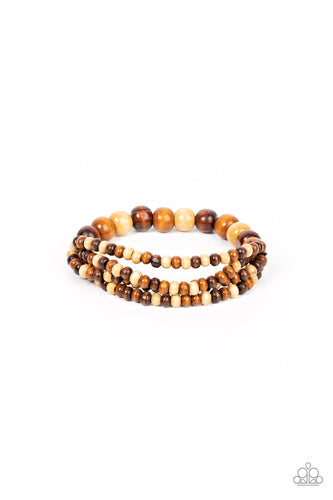 Varying in natural wooden finishes, stretchy strands of dainty wooden beads attach to a single row of oversized wooden beads around the wrist for an earthy spin on the homespun trend.