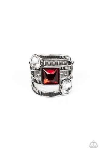 A row of oversized round white and square red rhinestones slant across layers of textured silver bands, stacking into a glitzy frame atop the finger. Features a stretchy band for a flexible fit. 