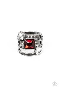 A row of oversized round white and square red rhinestones slant across layers of textured silver bands, stacking into a glitzy frame atop the finger. Features a stretchy band for a flexible fit. 