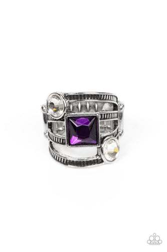 A row of oversized round white and square purple rhinestones slant across layers of textured silver bands, stacking into a glitzy frame atop the finger. Features a stretchy band for a flexible fit. 