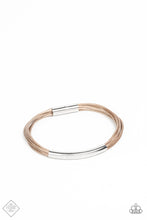 Load image into Gallery viewer, A contemporary curved silver cylinder slides along smooth strands of natural brown cording as they wrap around the wrist. The cording is capped in sleek silver fittings for a modern polished finish. Features a magnetic closure.  Sold as one individual bracelet.  Fashion Fix
