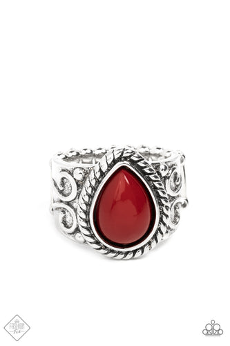 A stately red teardrop bead is encased in a layered frame of smooth and rope-like texture. The magnificent statement piece sits atop a wide silver band adorned with swirls of filigree and studded motifs making a grand display atop the finger. Features a stretchy band for a flexible fit.  Sold as one individual ring.