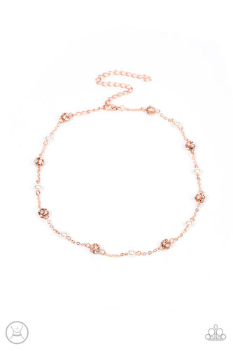 A dainty shiny copper chain dotted in bubbly white pearls and glitzy white rhinestone encrusted beads delicately connects around the neck, resulting in a timeless fashion. Features an adjustable clasp closure.