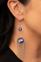 Load image into Gallery viewer, Tiers of dainty silver chains delicately layer from an oversized oval iridescent blue gem that is suspended from a faceted matching blue crystal-like bead, resulting in an ethereal chandelier. Earring attaches to a standard fishhook fitting. 
