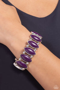 Encased in sleek silver frames, oversized plum beaded frames alternate with pairs of classic silver beads along stretchy bands around the wrist for a vivacious pop of color.Encased in sleek silver frames, oversized plum beaded frames alternate with pairs of classic silver beads along stretchy bands around the wrist for a vivacious pop of color.  Sold as one individual bracelet.