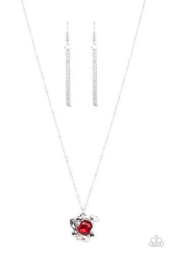 A glitzy collection of dainty silver studs, an emerald cut red, and smoky and iridescent marquise cut rhinestones delicately coalesce into a clustered pendant, resulting in a timeless sparkle below the collar. Features an adjustable clasp closure.