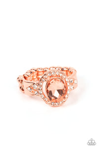 Reminiscent of an engagement ring, a coppery oval gem is showcased atop a white rhinestone encrusted shiny copper setting for an elegantly stellar finish. Features a dainty stretchy band for a flexible fit.