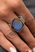 Load image into Gallery viewer, Featuring a purple UV finish, a faceted geometric multicolored gem sits asymmetrically atop the finger for a stellar finish. Features a stretchy band for a flexible fit.
