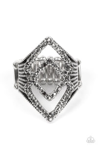 A pair of hematite encrusted diamond shaped frames stacks atop studded silver fittings, culminating into an edgy sparkle. Features a stretchy band for a flexible fit.