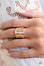 Load image into Gallery viewer, Wavy gold bars border a flattened gold frame that is etched with subtle textures, resulting in a reflective shimmer around the finger. Features a stretchy band for a flexible fit.  Sold as one individual ring.  New Kit Fashion Fix
