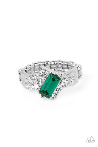 An emerald cut green rhinestone slants across the front of an asymmetrical silver frame dotted in glassy white rhinestones, resulting in a radiant centerpiece atop the finger. Features a stretchy band for a flexible fit.